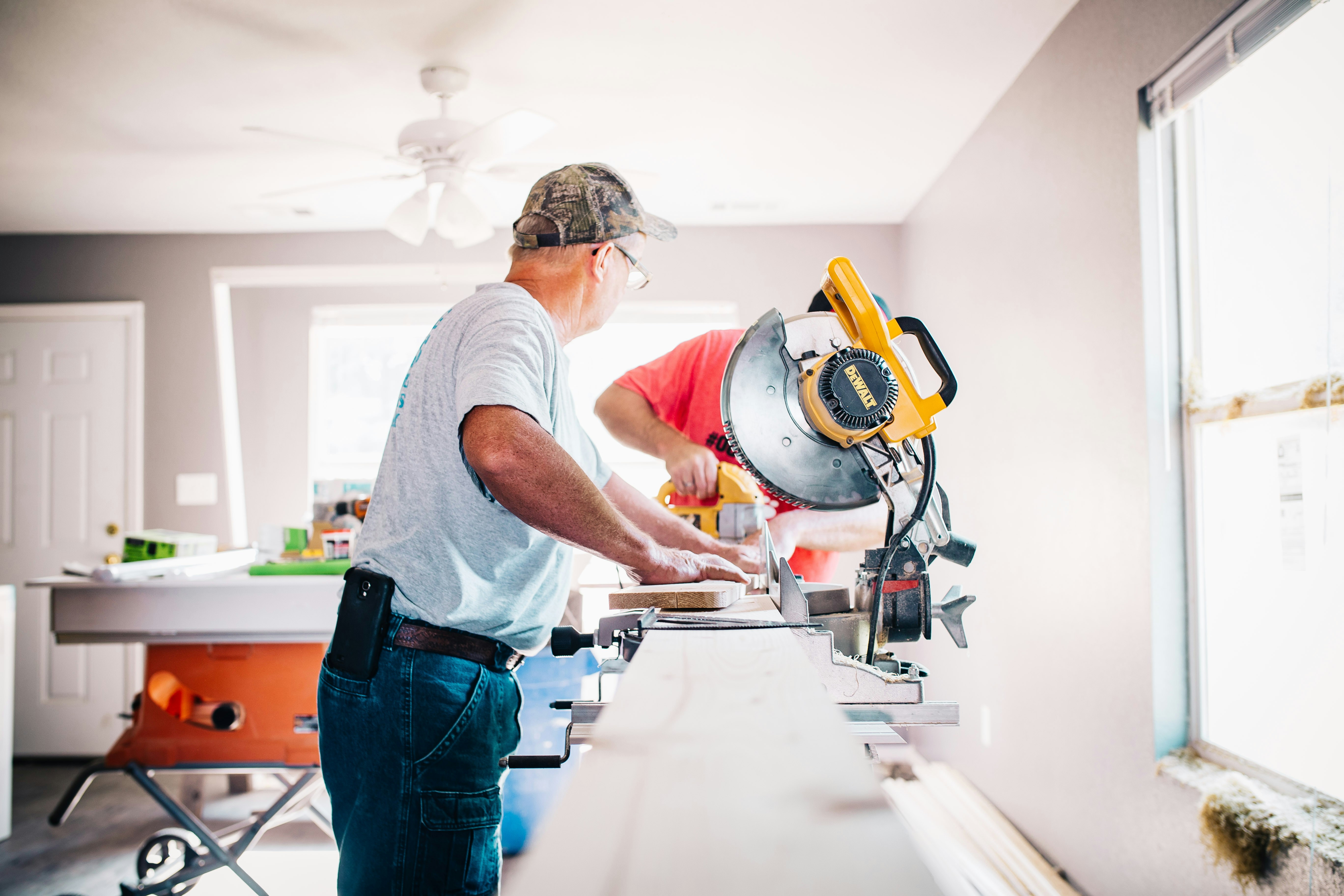 Contractor using a miter saw during property renovation work