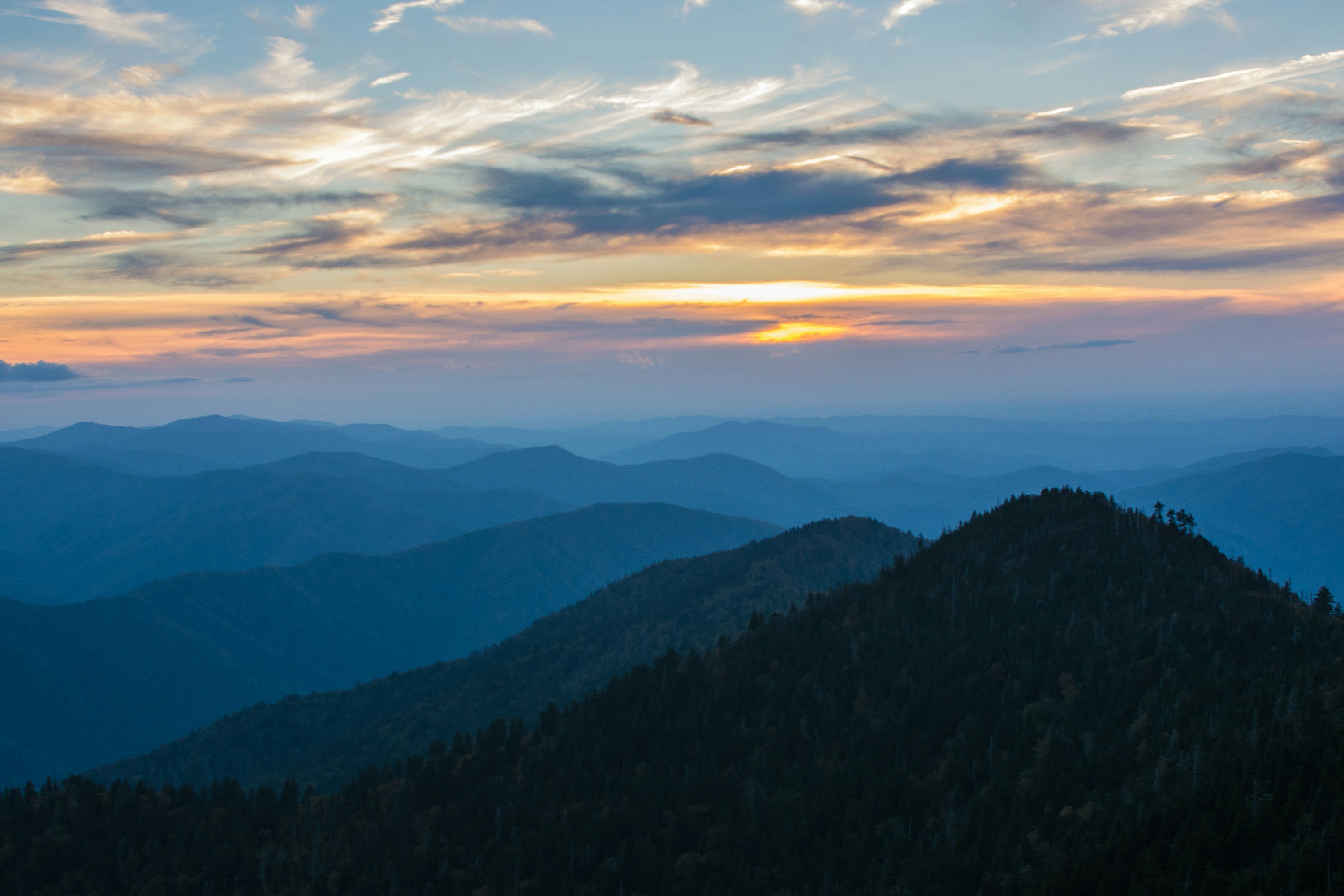 Smoky Mountain ridges at sunset with layered blue hills
