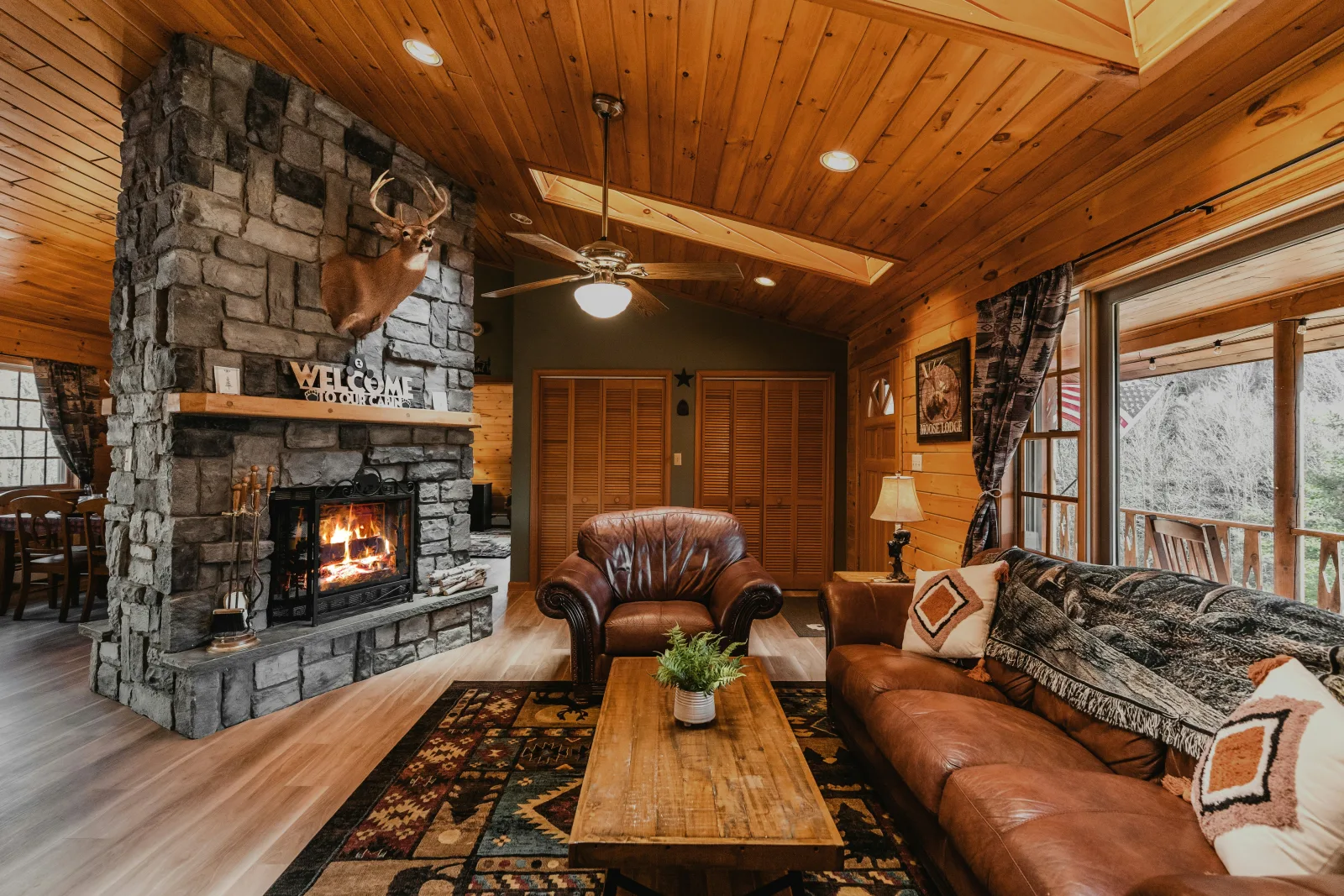 Aspen ski chalet interior with vaulted ceiling and slopeside view