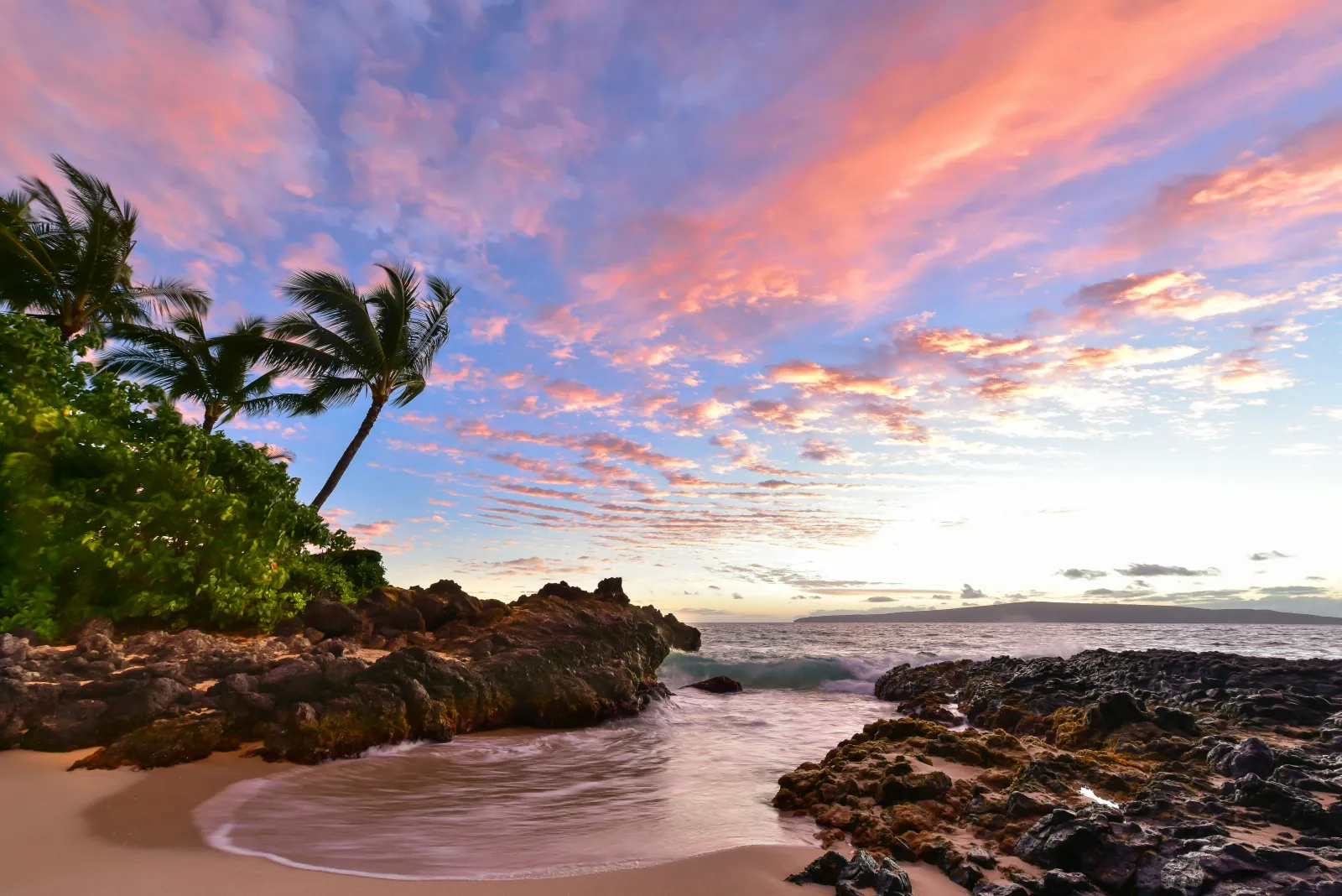 Maui Wailea oceanfront vacation rental condo with lanai and tropical landscape