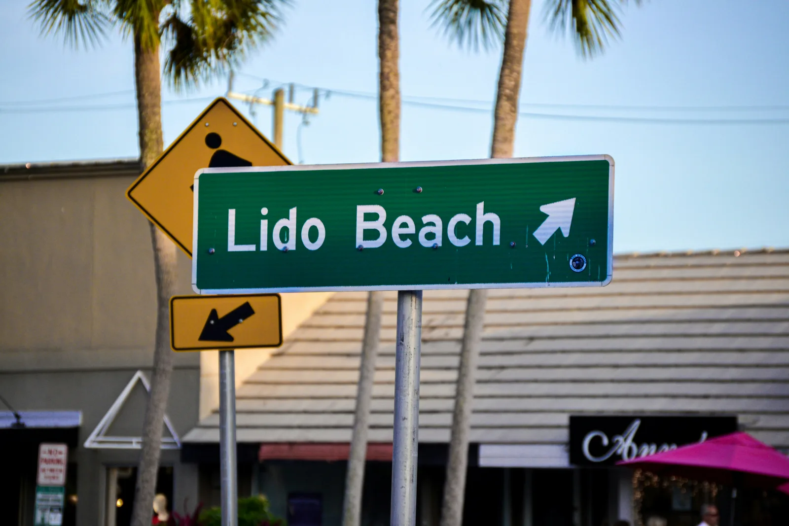 Sarasota Lido Key beach with crystal-clear Gulf waters and beachfront condos